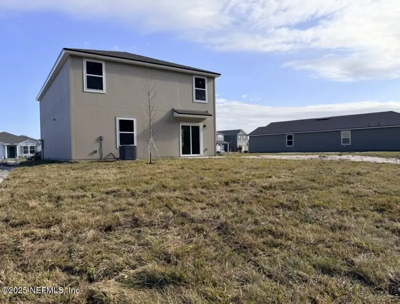 Exterior details and patio area of a home in The Arbors, Jacksonville (Image 3).