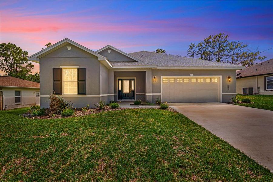 Front exterior of a new home in , Citrus Springs, FL, highlighting curb appeal (Image 23).