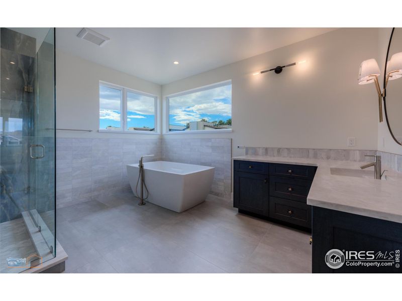 Primary Bath Features A Bain Ultra Air Jetted Tub, Large Marble & Tile Shower, Heated Floor, Double Vanities, Private Commode And Linen Closet