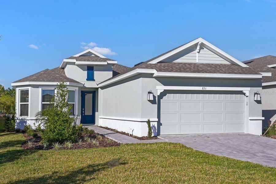 Front exterior of a new home in Esplanade at Center Lake Ranch, St. Cloud, FL, highlighting curb appeal (Image 2).