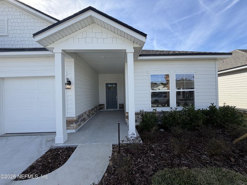 Exterior details and patio area of a home in The Cypress Series at Reserve East, Flagler Beach (Image 3).