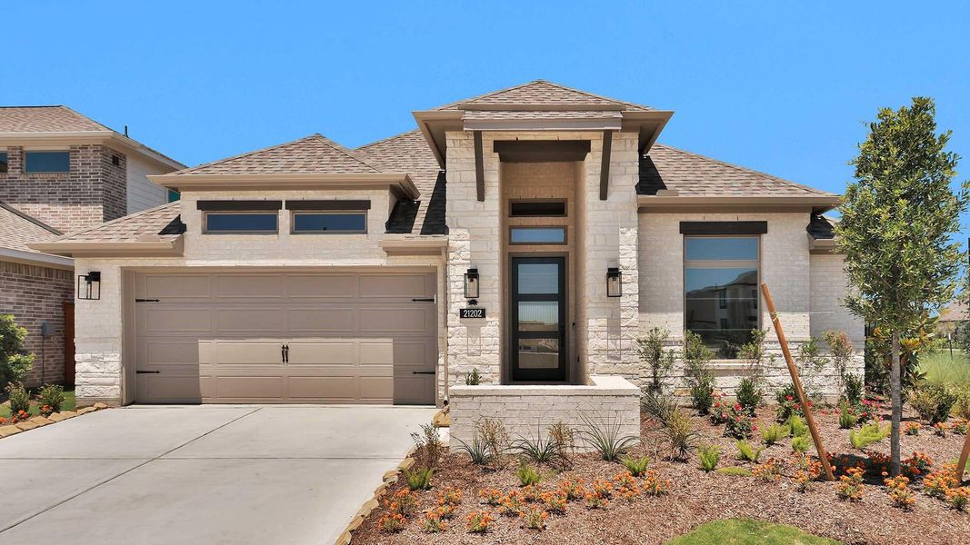 Front exterior of a new home in Bridgeland, Cypress, TX, highlighting curb appeal (Image 2). Front exterior of a new home in Bridgeland, Cypress, TX, highlighting curb appeal (Image 2).