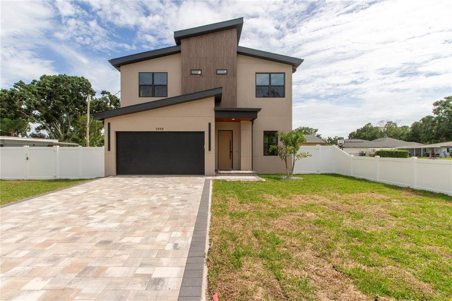 Front exterior of a new home in , Tampa, FL, highlighting curb appeal (Image 37).