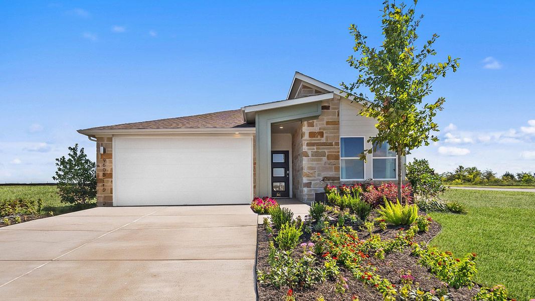 Front exterior of a new home in Trails at Wildhorse, Austin, TX, highlighting curb appeal (Image 1). Front exterior of a new home in Trails at Wildhorse, Austin, TX, highlighting curb appeal (Image 1).