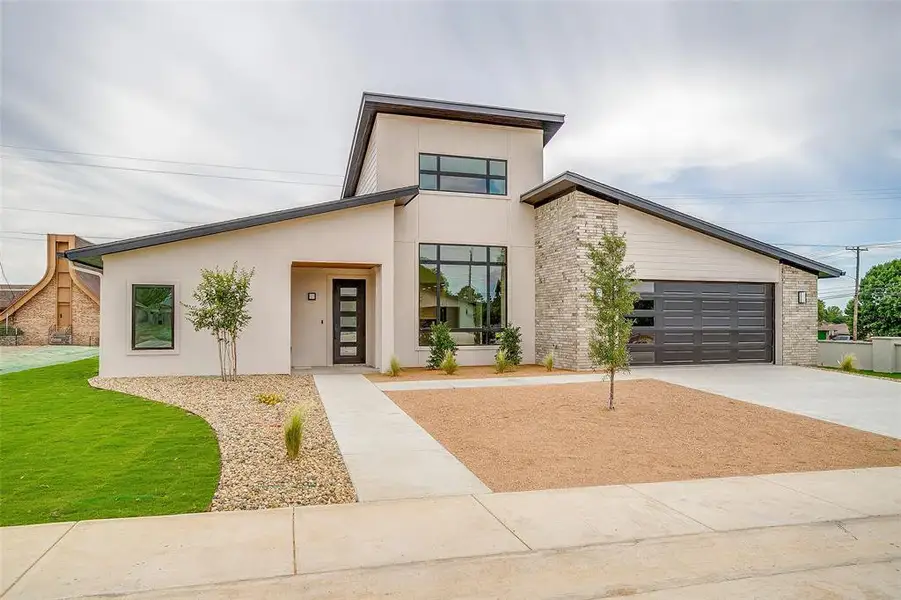 Front exterior of a new home in , Mineral Wells, TX, highlighting curb appeal (Image 1). Front exterior of a new home in , Mineral Wells, TX, highlighting curb appeal (Image 1).