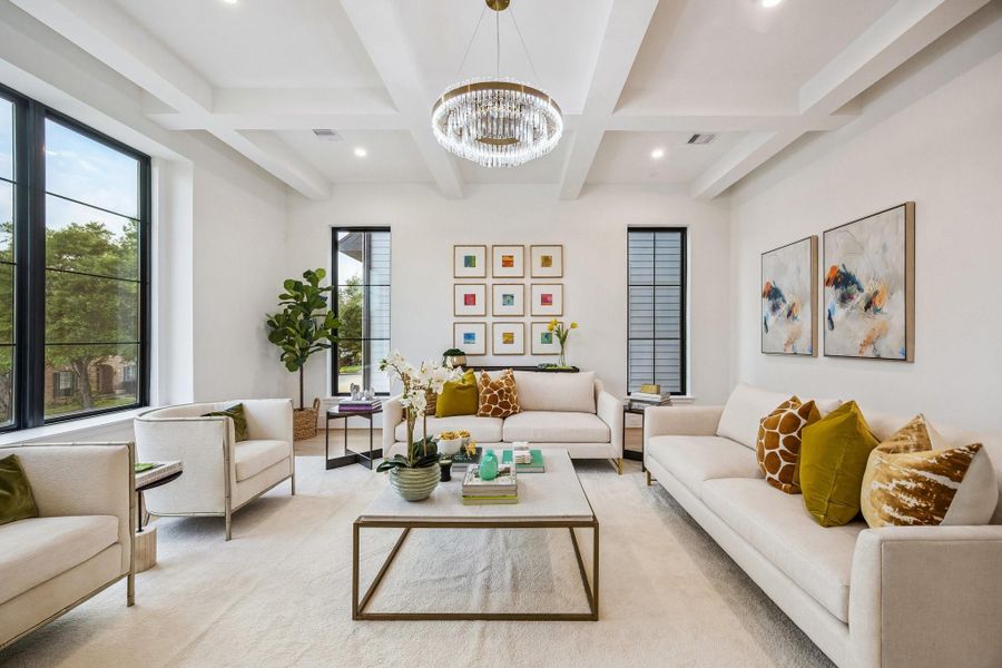 Ceiling with Painted Boxed Beam Detailing with a Modern Tiered Crystal LED Chandelier In Brass.  Beautiful Anderson Divided Lite Windows.