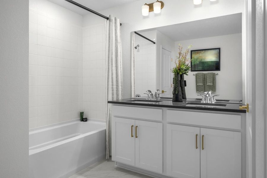 Dual sink vanity at primary bathroom