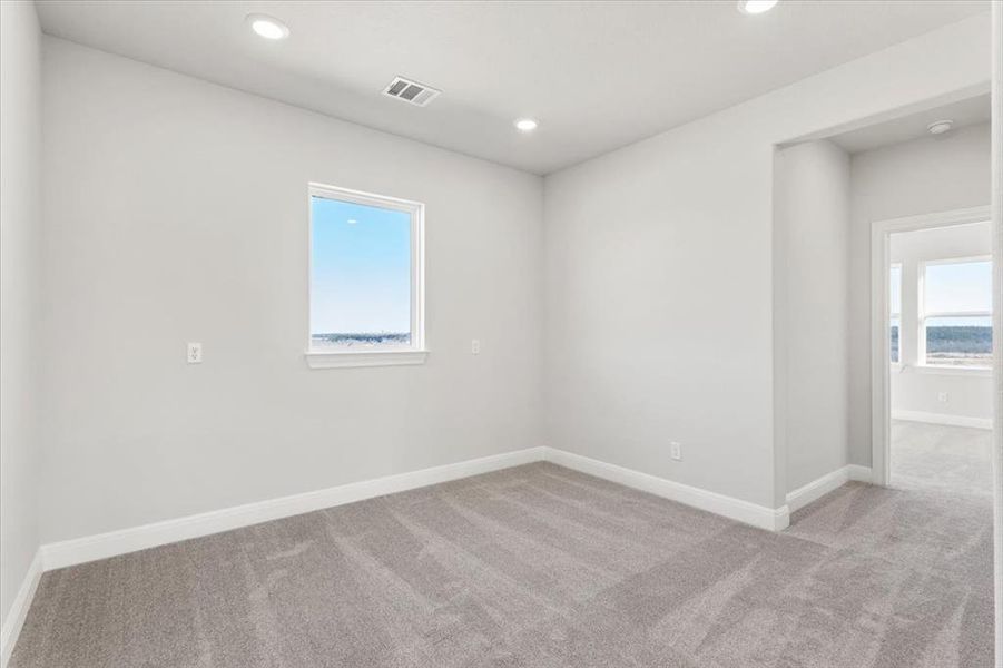 Spare room with carpet and recessed lighting