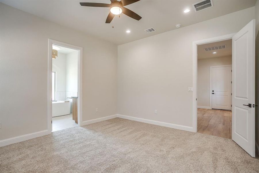 Unfurnished room featuring light carpet, recessed lighting, and a ceiling fan Unfurnished room featuring light carpet, recessed lighting, and a ceiling fan