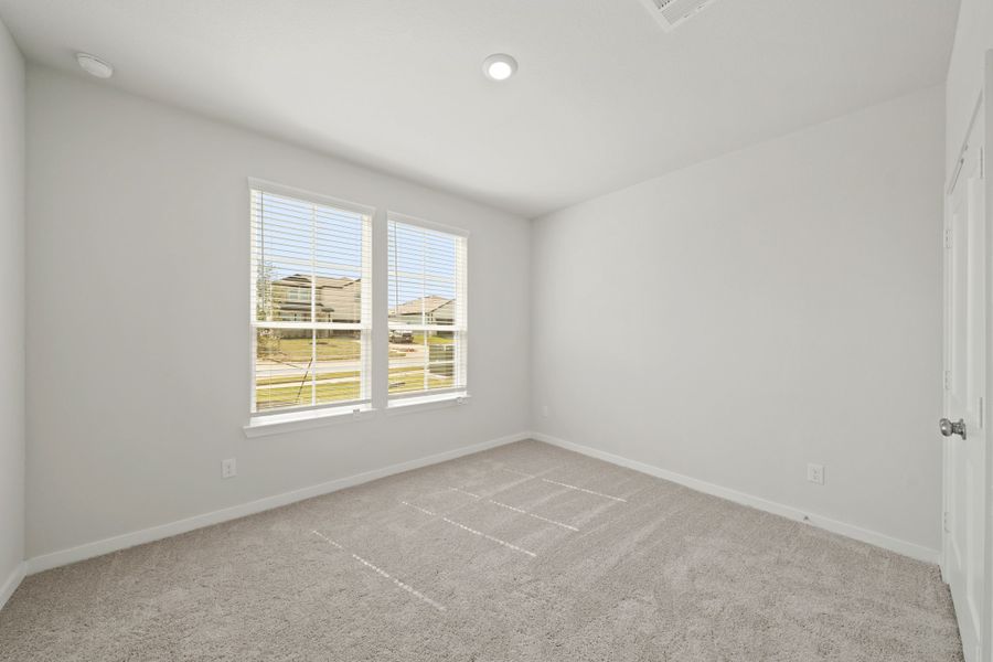 A room with a window and a tile floor. A room with a window and a tile floor.