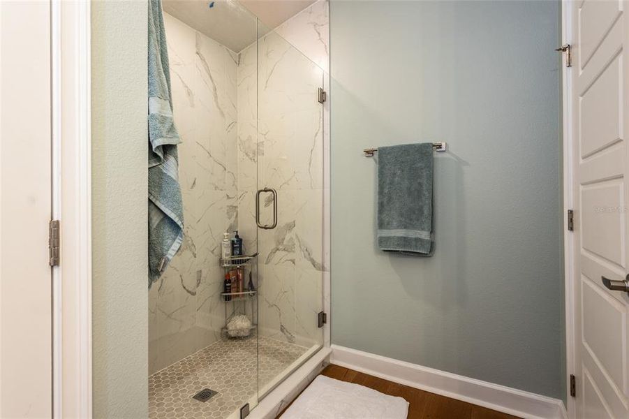 tiled shower with custom 4mm frameless glass door