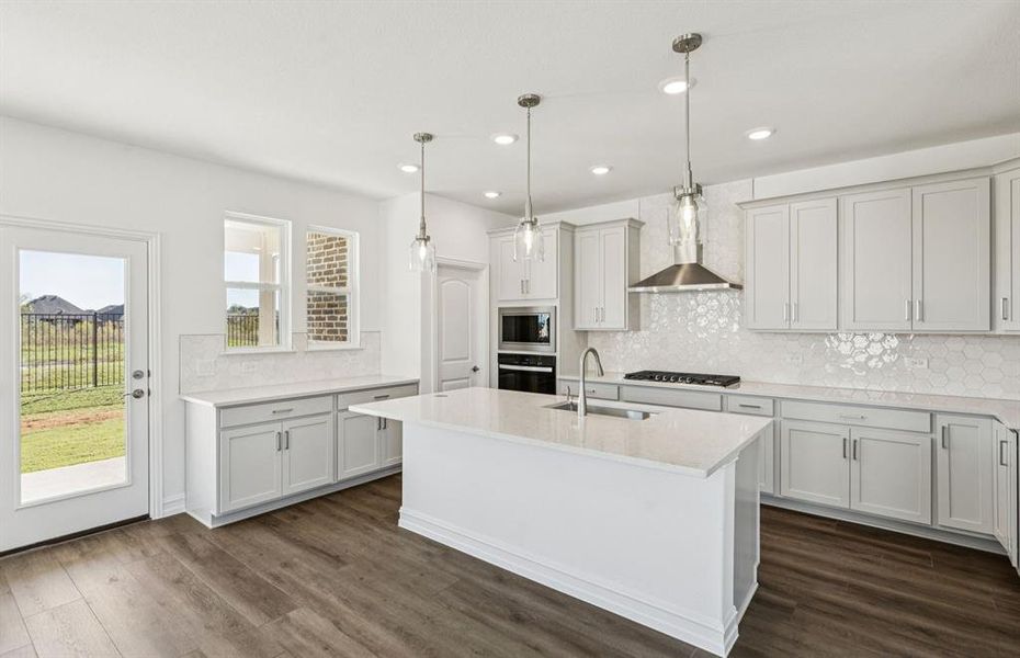 Spacious kitchen with eat-in bartop island Spacious kitchen with eat-in bartop island