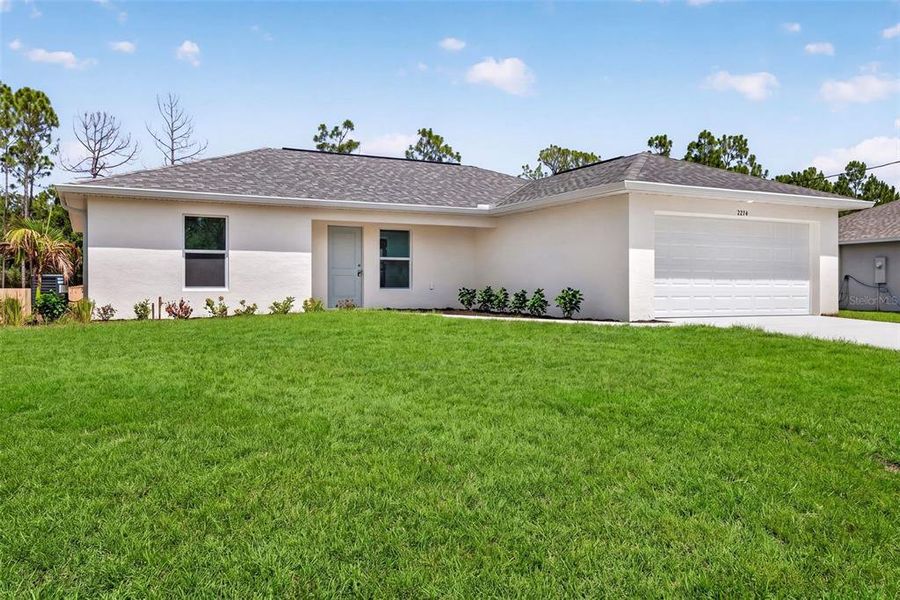Front exterior of a new home in , Port Charlotte, FL, highlighting curb appeal (Image 2). Front exterior of a new home in , Port Charlotte, FL, highlighting curb appeal (Image 2).