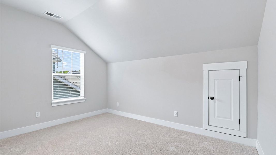 Elegant bedroom retreat featuring soft carpet and oversized windows that create a bright, welcoming space Elegant bedroom retreat featuring soft carpet and oversized windows that create a bright, welcoming space