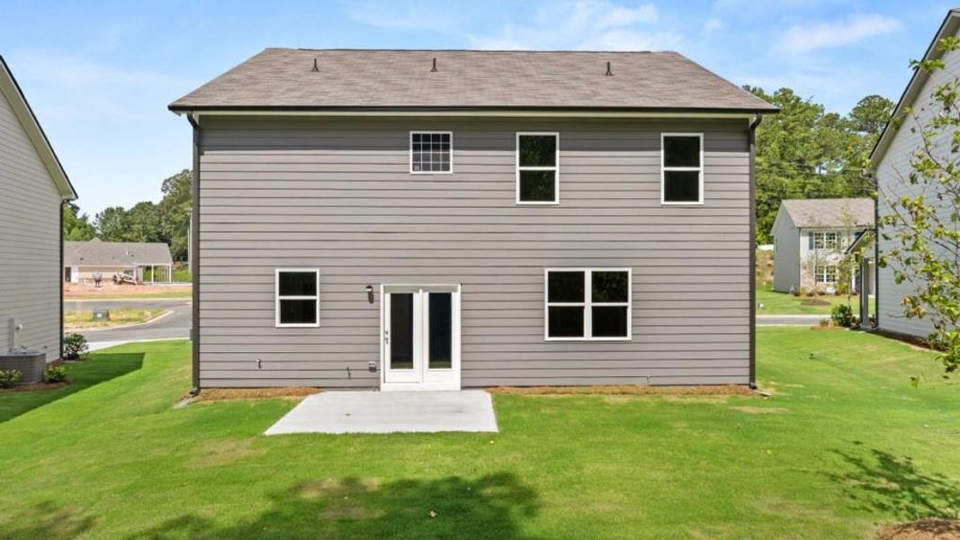 Exterior details and patio area of a home in Northwoods at Mirror Lake, Villa Rica (Image 4).
