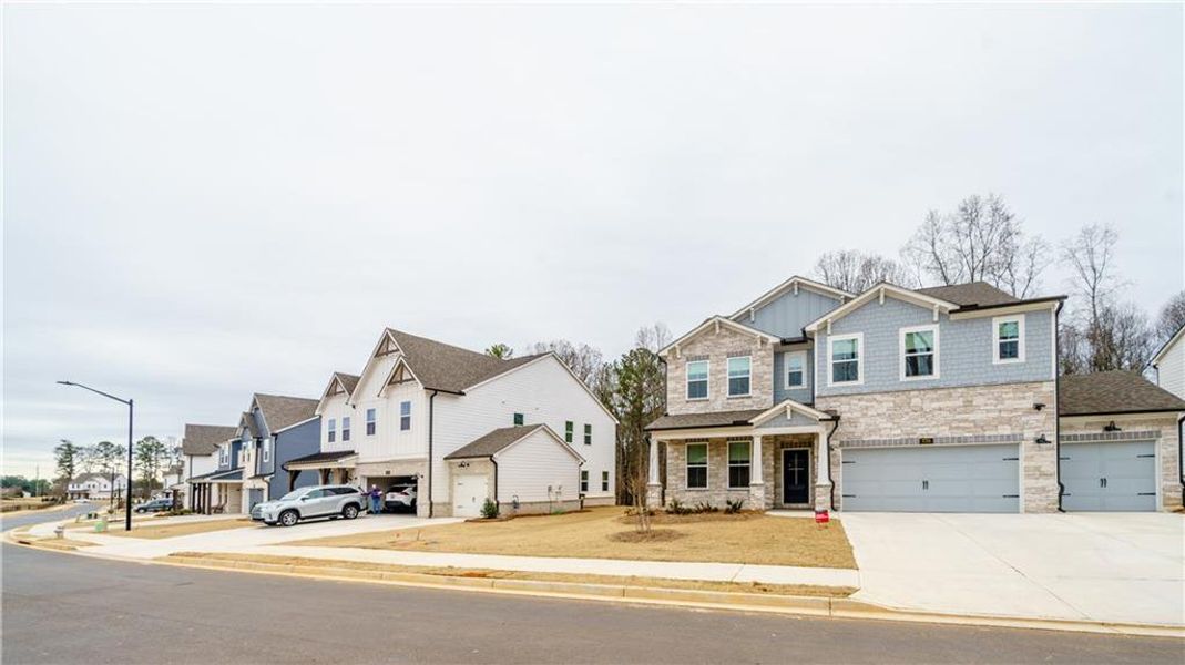 Front exterior of a new home in , Powder Springs, GA, highlighting curb appeal (Image 30). Front exterior of a new home in , Powder Springs, GA, highlighting curb appeal (Image 30).