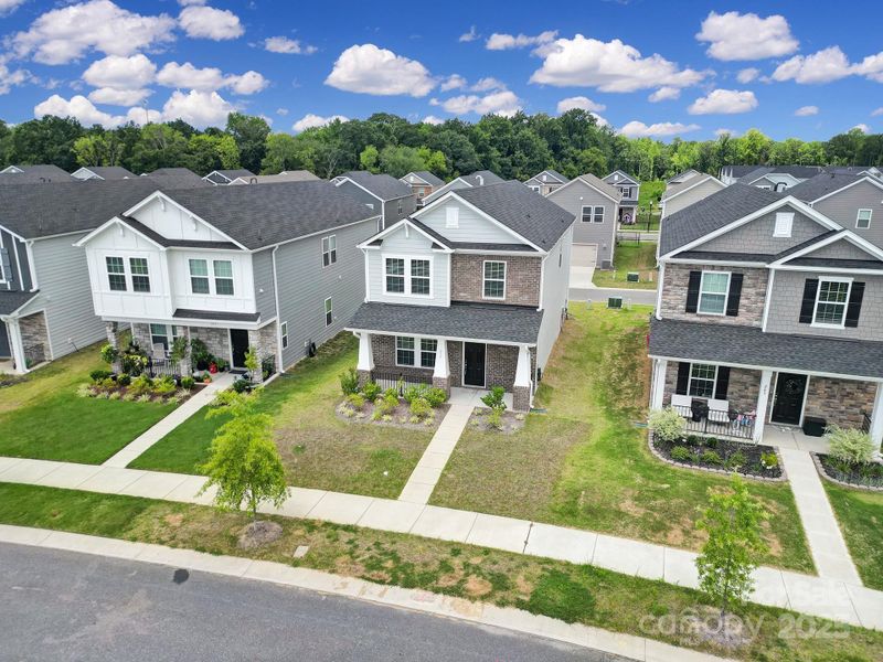Front exterior of a new home in Preston Park, Pineville, NC, highlighting curb appeal (Image 1). Front exterior of a new home in Preston Park, Pineville, NC, highlighting curb appeal (Image 1).