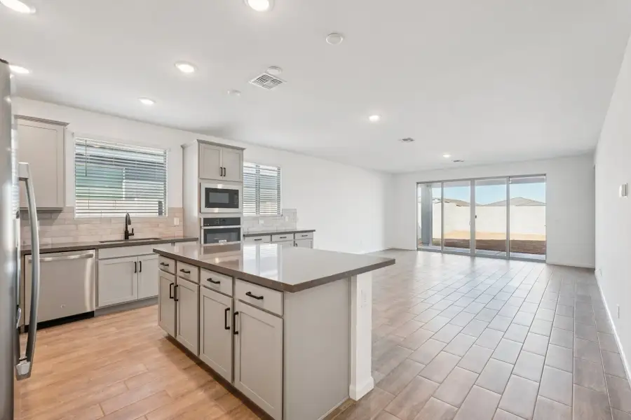 Kitchen, dining and great room. Finishes and options may vary.