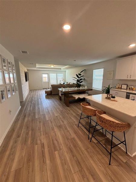 Dining space featuring light wood-style flooring, plenty of natural light, and recessed lighting