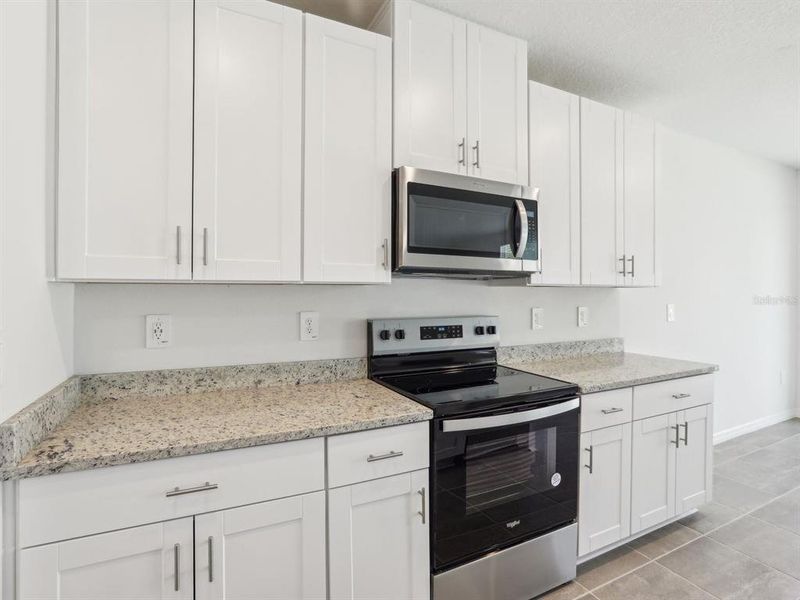 Furnished interior view inside a new home in The Reserve at Van Oaks, Auburndale (Image 14).