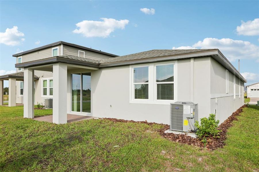 Exterior details and patio area of a home in Springs at Lake Alfred - Classic Series, Lake Alfred (Image 27).