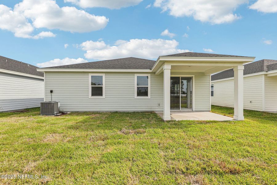 Exterior details and patio area of a home in Cypress Meadows - Signature Series, Jacksonville (Image 4).