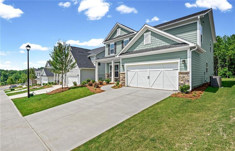 Front exterior of a new home in Hunters Creek, Flowery Branch, GA, highlighting curb appeal (Image 19).