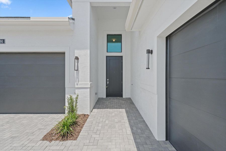 Exterior details and patio area of a home in Cresswind Palm Beach at Westlake, Westlake (Image 4). Exterior details and patio area of a home in Cresswind Palm Beach at Westlake, Westlake (Image 4).