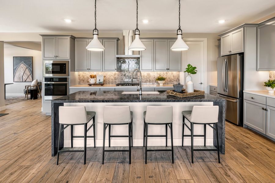 Representative furnished interior of a home built from the Viridian Plan 4004 by Tri Pointe Homes in Waterston Central, Gilbert (Image 7).