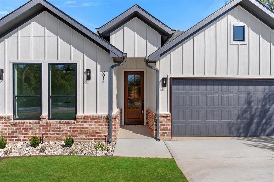 Modern inspired farmhouse featuring a garage