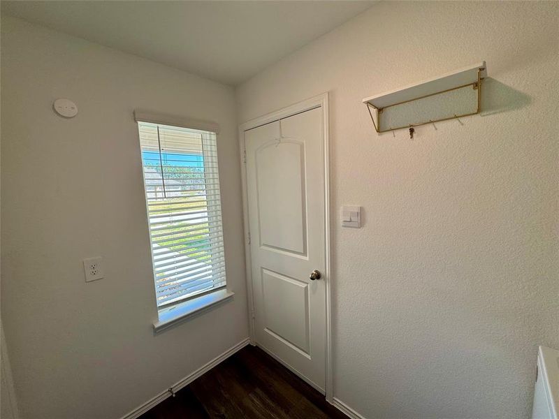 Utility room with window coverings.House has double pane Low-E Vinyl windows