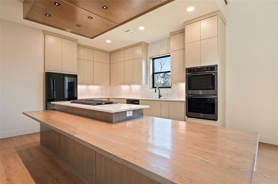 Huge custom island that doubles as a dining table