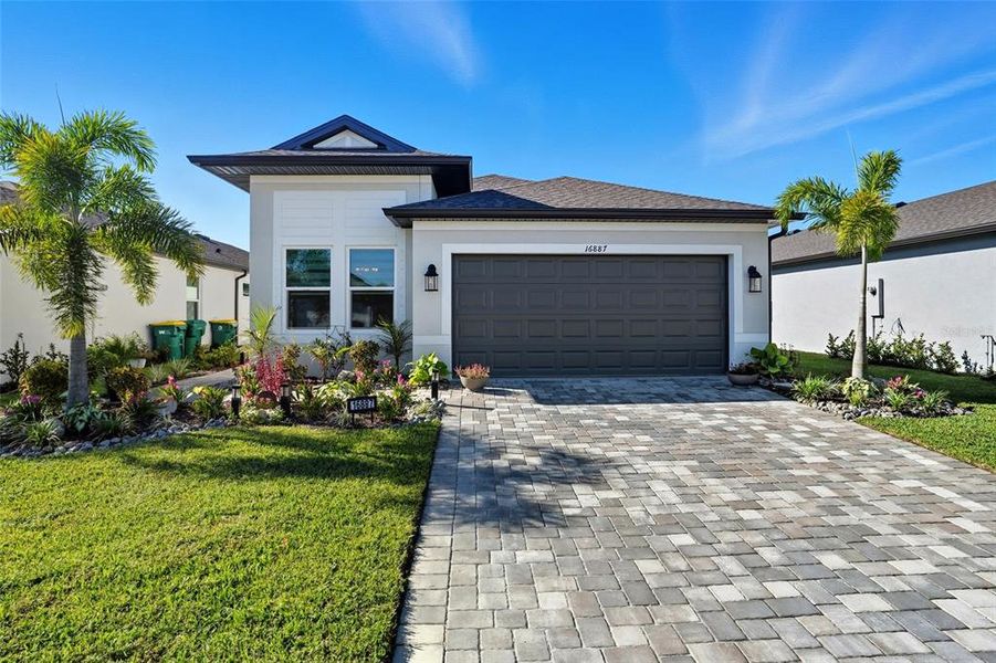 Front exterior of a new home in , Port Charlotte, FL, highlighting curb appeal (Image 21). Front exterior of a new home in , Port Charlotte, FL, highlighting curb appeal (Image 21).