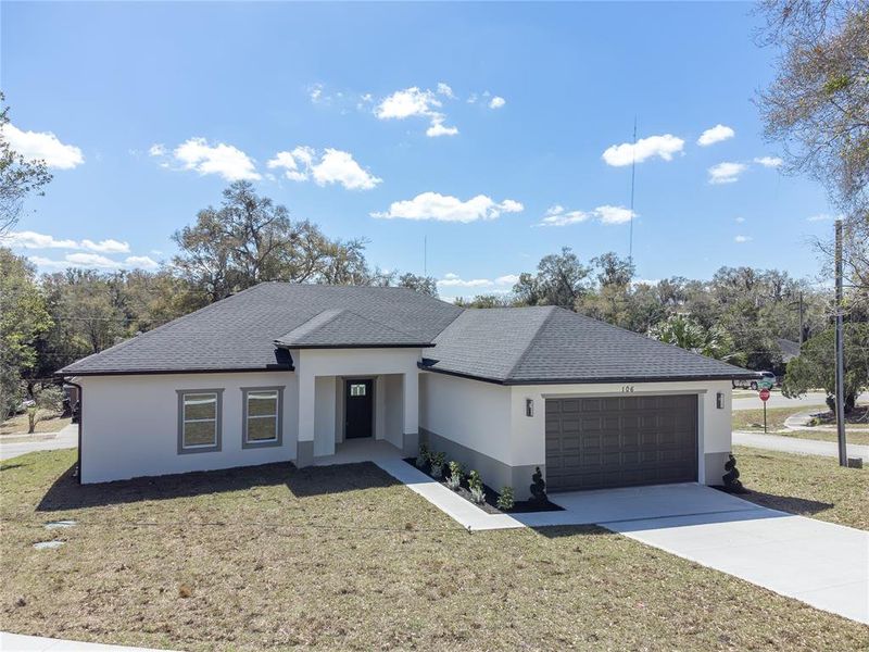 Front exterior of a new home in , Orange City, FL, highlighting curb appeal (Image 32).