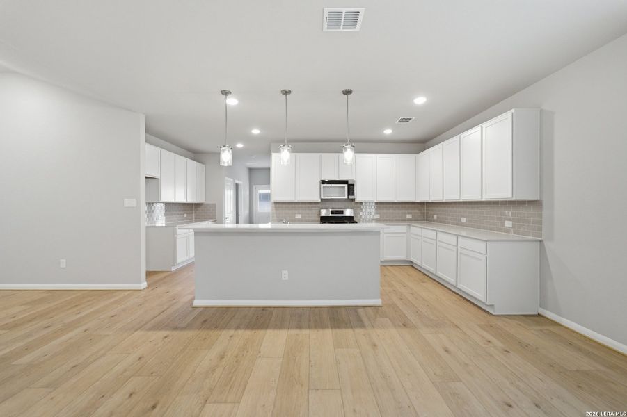 Furnished interior view inside a new home in Hennersby Hollow, San Antonio (Image 8).