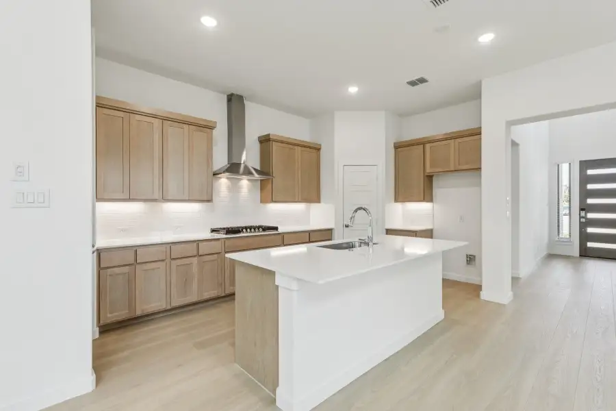 Kitchen in the Da Vinci II home plan by Trophy Signature Homes – REPRESENTATIVE PHOTO