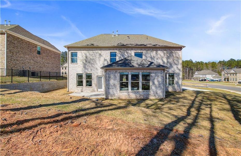 Front exterior of a new home in Trinity Park, McDonough, GA, highlighting curb appeal (Image 24).