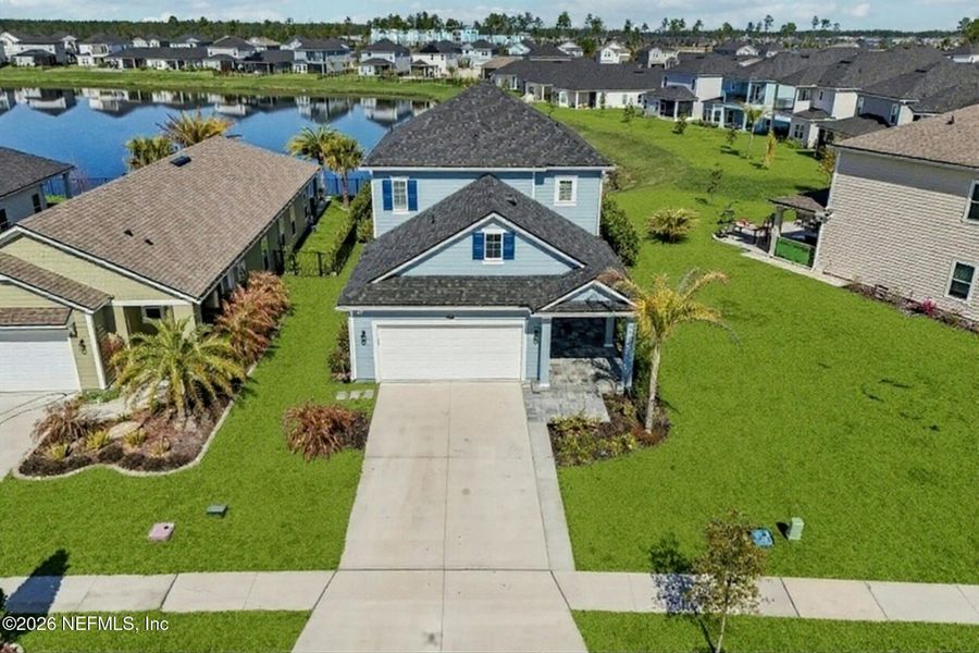 Front exterior of a new home in Beacon Lake, St. Augustine, FL, highlighting curb appeal (Image 29).