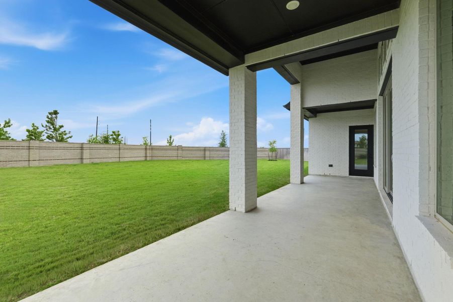 Covered porch and large backyard