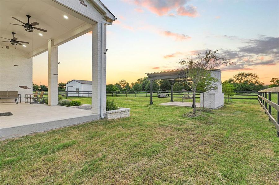 View of yard with a patio and ceiling fan View of yard with a patio and ceiling fan