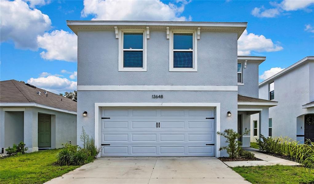 Front exterior of a new home in Heritage Hills, Dade City, FL, highlighting curb appeal (Image 23). Front exterior of a new home in Heritage Hills, Dade City, FL, highlighting curb appeal (Image 23).