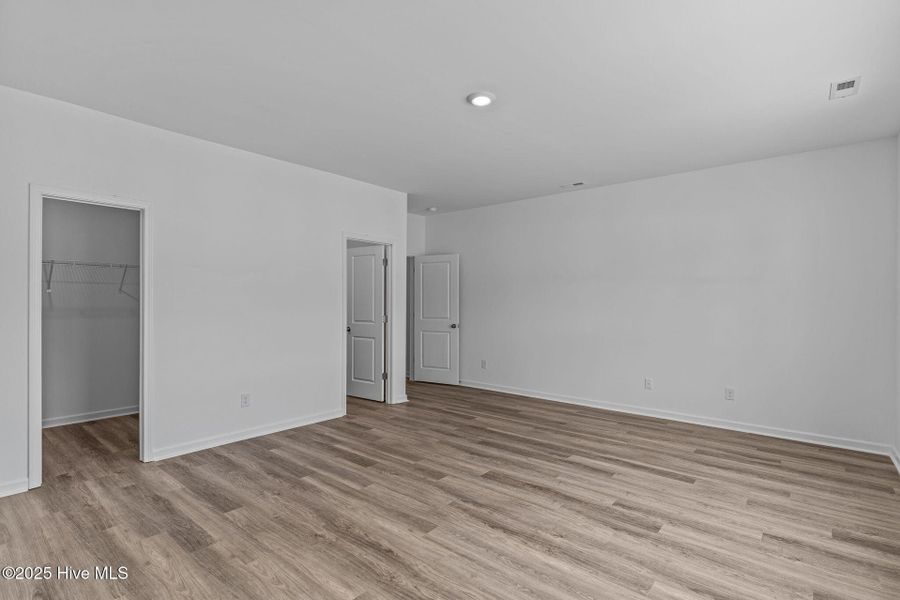 Spacious, unfurnished interior of a new home in Coastal Haven Townes, Leland (Image 23).
