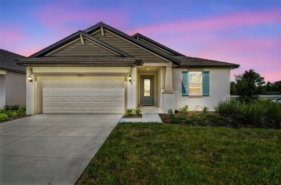 Front exterior of a new home in Pinecone Reserve, Brooksville, FL, highlighting curb appeal (Image 2). Front exterior of a new home in Pinecone Reserve, Brooksville, FL, highlighting curb appeal (Image 2).