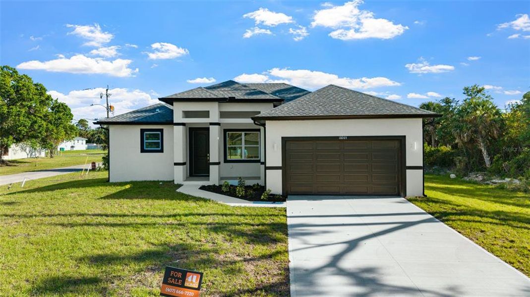 Front exterior of a new home in , Port Charlotte, FL, highlighting curb appeal (Image 18). Front exterior of a new home in , Port Charlotte, FL, highlighting curb appeal (Image 18).