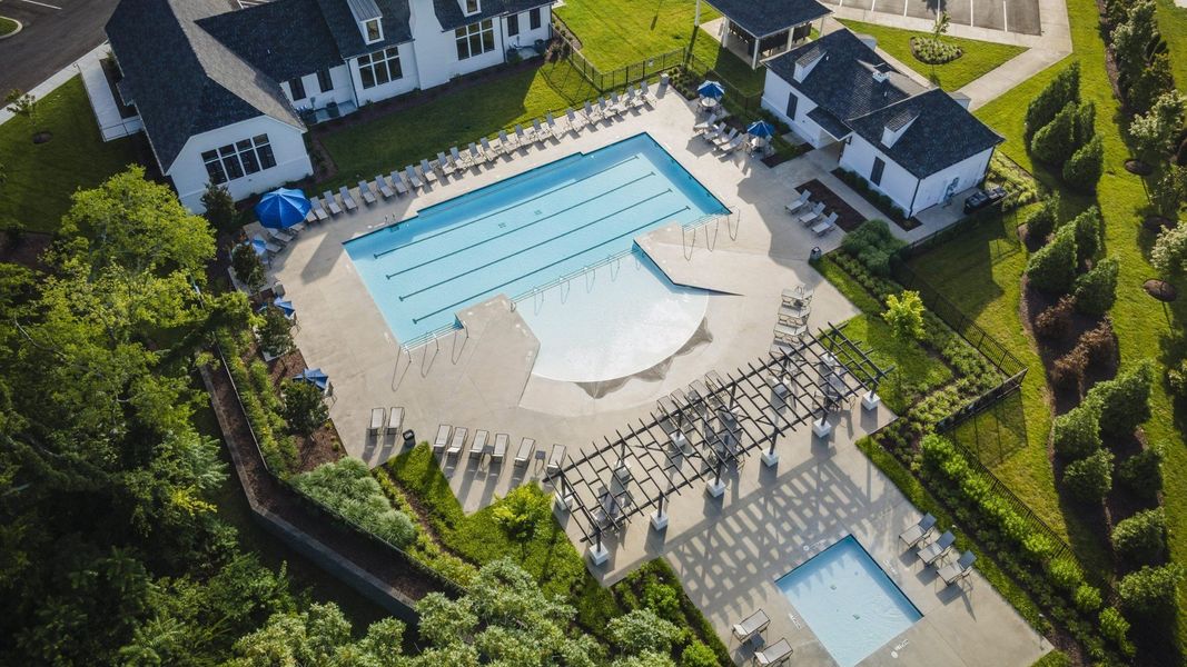 Outdoor sizeable neighborhood pool with hot tub and outdoor laying space