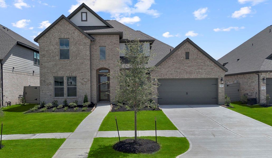 Front exterior of a new home in Pomona 60', Manvel, TX, highlighting curb appeal (Image 18). Front exterior of a new home in Pomona 60', Manvel, TX, highlighting curb appeal (Image 18).