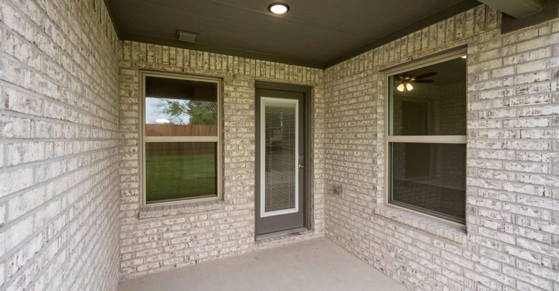 Representative exterior photo of a completed home built from the Boston by Impression Homes in Baker Farms, Cleburne, TX (Image 27).