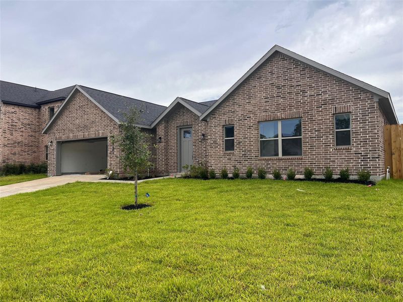 Front exterior of a new home in , Spring, TX, highlighting curb appeal (Image 1). Front exterior of a new home in , Spring, TX, highlighting curb appeal (Image 1).