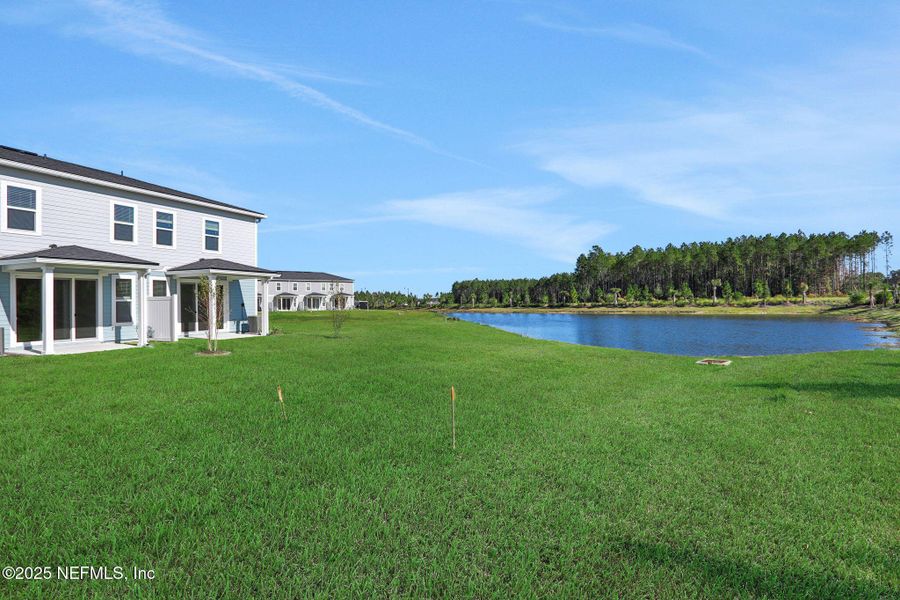 Exterior details and patio area of a home in Brook Forest - Townhomes, St. Augustine (Image 26).