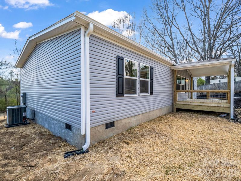 Exterior details and patio area of a home in , East Flat Rock (Image 20).